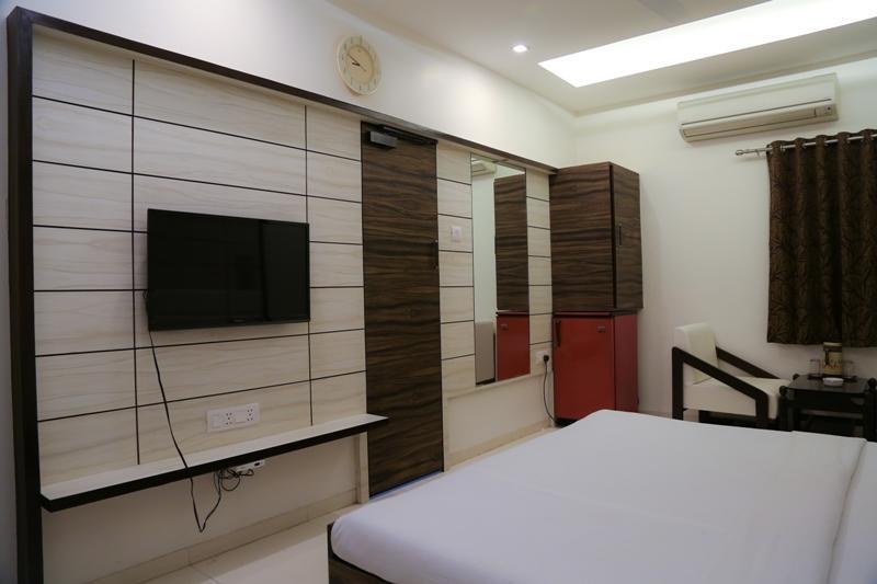 Hotel Golden Plaza Ahmadábád Pokoj fotografie